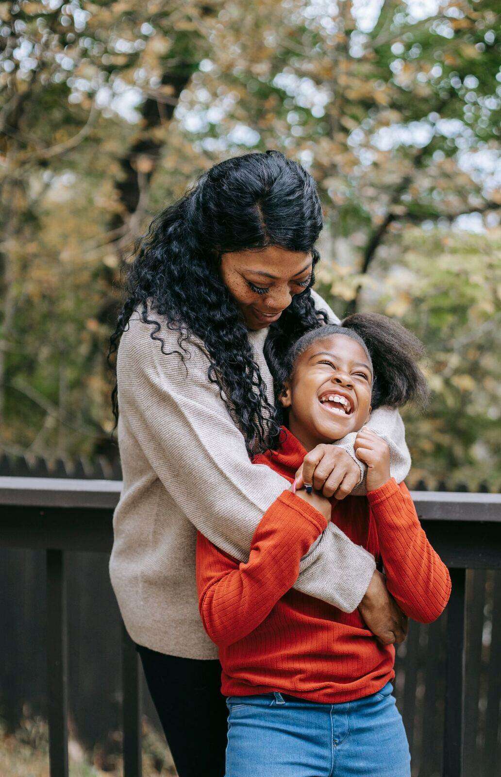 A mother and her daughter together outdoors