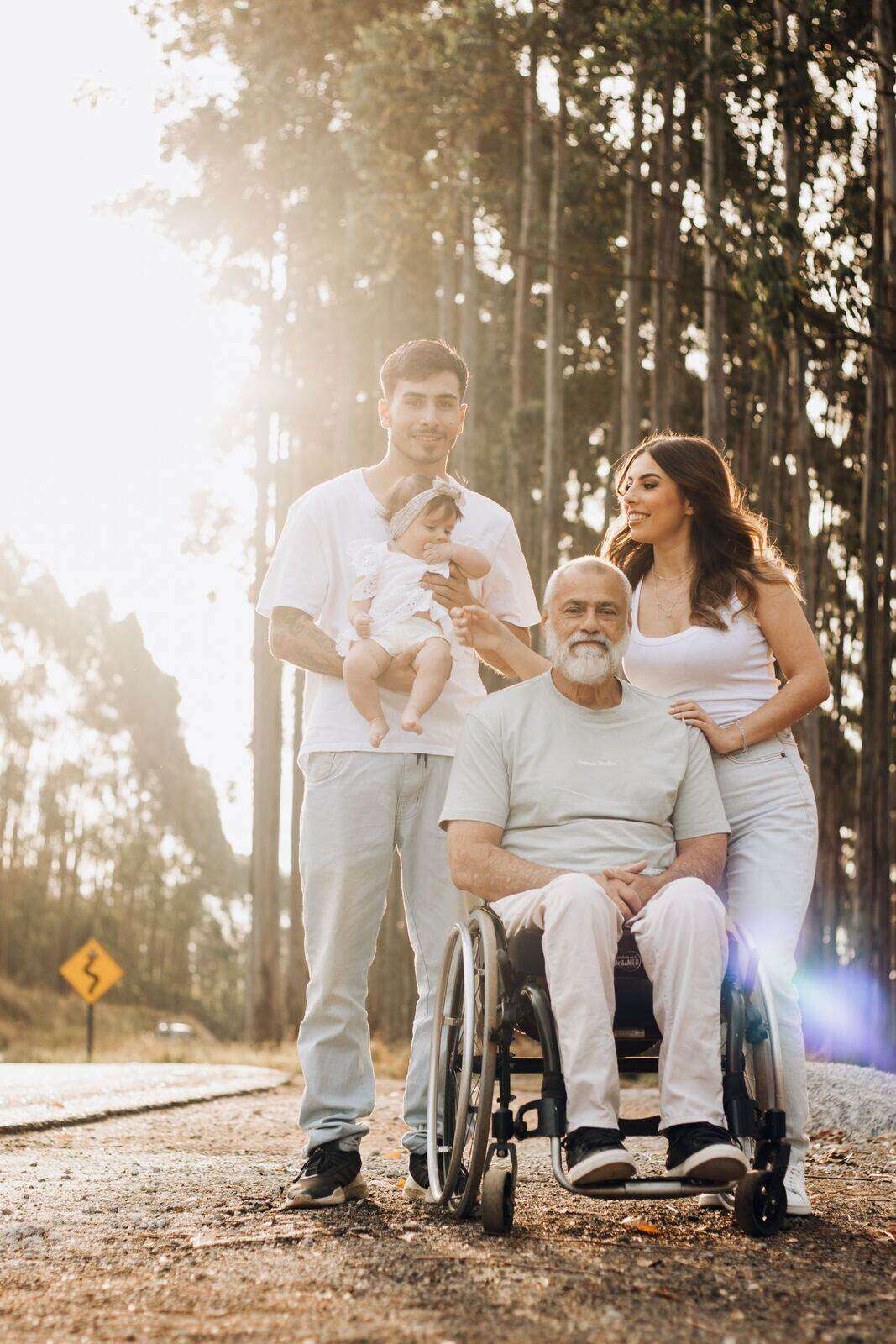 A family spending time with an older relative who uses a wheelchair